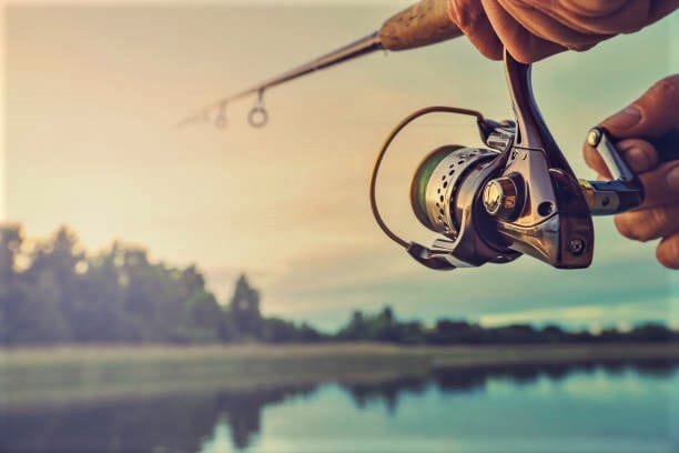 Fishing on the lake at sunset. Fishing background.